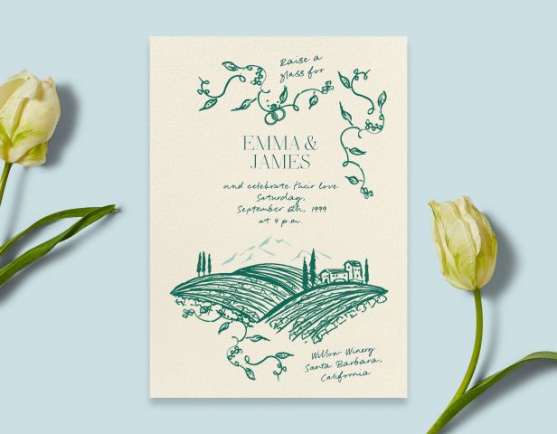 A blue background with off white tulips paired with a wedding invitation featuring a teal illustration of hills and a home with vine flourishes. 